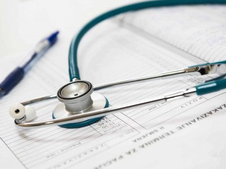 A doctor's stethoscope and medical form