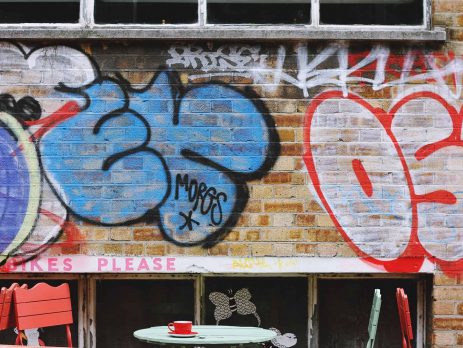 A graffitied brick wall