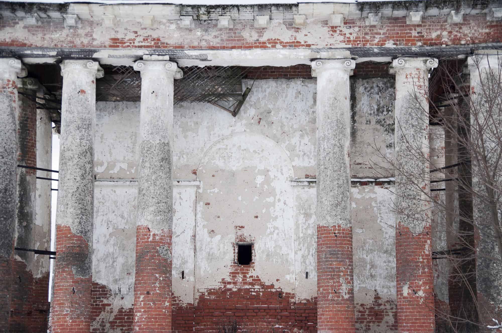 An old building with four brick columns