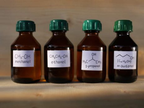 Four brown bottles of solvents