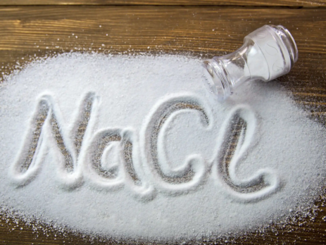 NaCl written in spilled salt on table