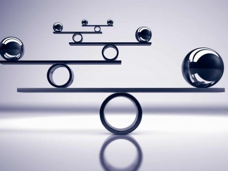 Business and lifestyle balance concept with balanced metal balls on grey background 3D illustration