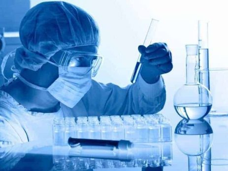 Scientist analysing chemicals in a lb
