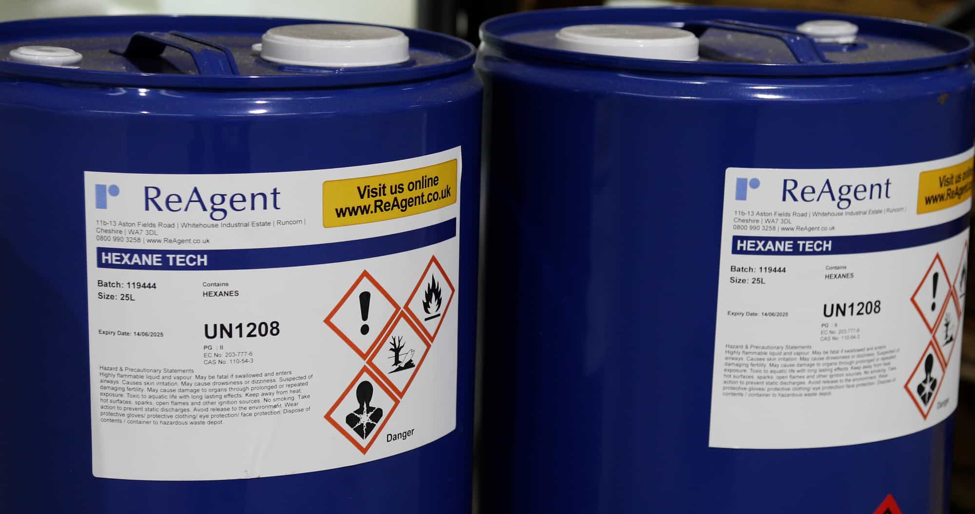 Chemicals stored in plastic containers with hazardous information labels