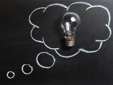 Lightbulb in a thought bubble written on a chalkboard
