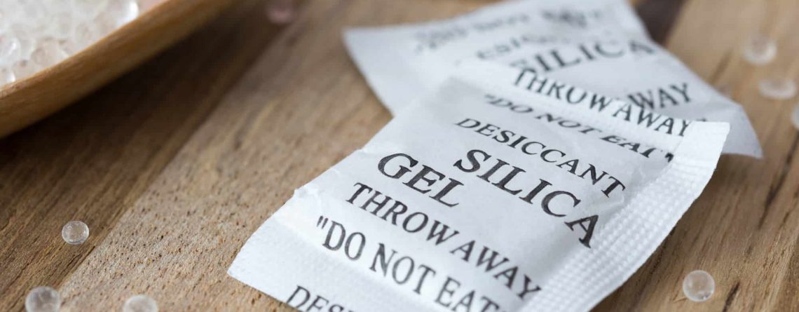 Packets of silica gel on table
