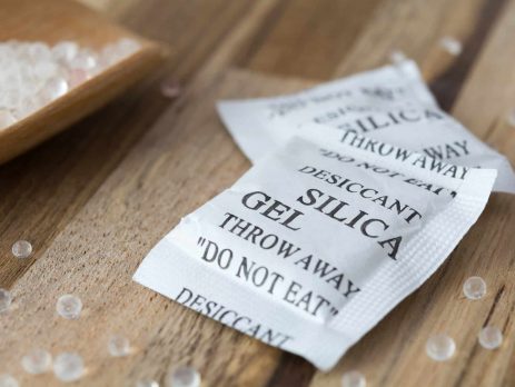 Packets of silica gel on table