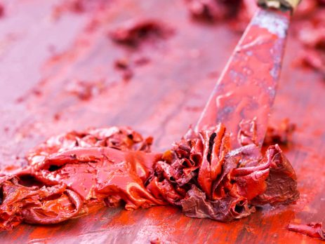 Red paint getting stripped from wood