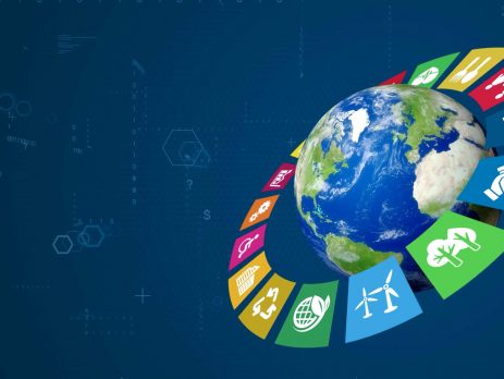 Graphic of Earth surrounded by icons linked to sustainability, like recycling, trees, and wind turbines