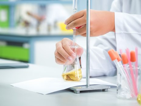 Scientist with titration instrument