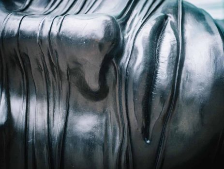 A silver sculpture of a face