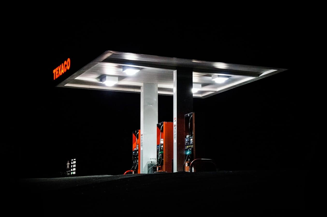 A shot of a Texaco petrol station at night time