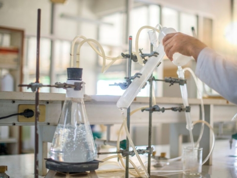 Scientists experimenting with distillation in a lab