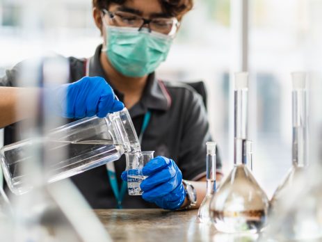 Chemist working with alcohol
