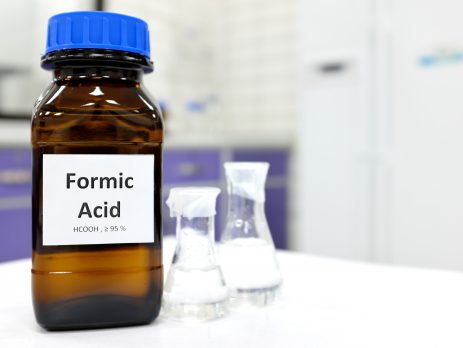 A bottle of formic acid and two flasks