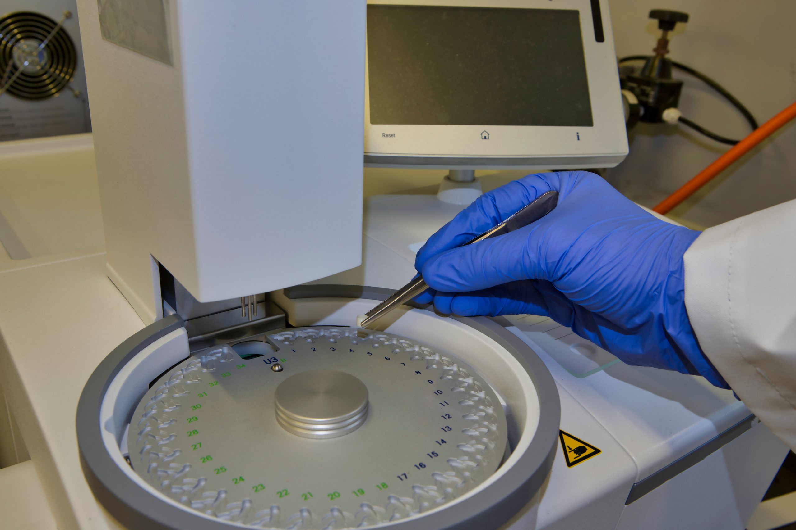 A scientist analysing a sample through differential calorimetry analysis