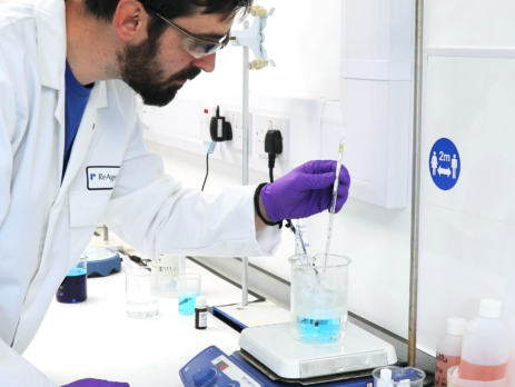 ReAgent employee mixing a solution