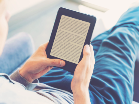 Man reading on his Kindle