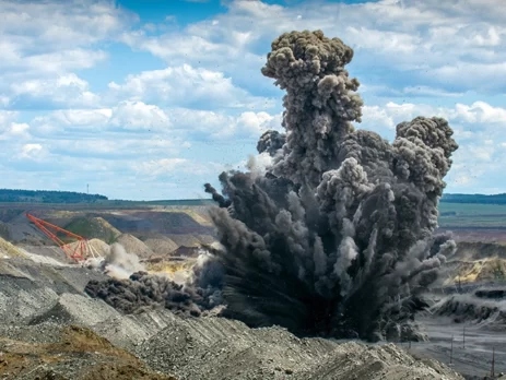 Controlled explosion in an open pit mine