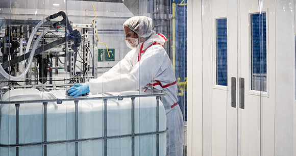 ReAgent employee prepping diagnostic reagents in a cleanroom