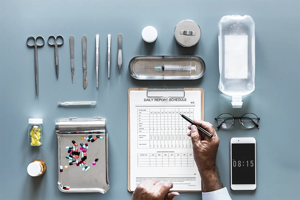 Doctors table with medicine including distilled water