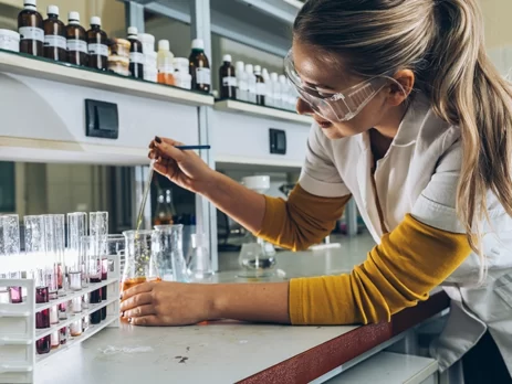 A Level student studying a chemistry lab