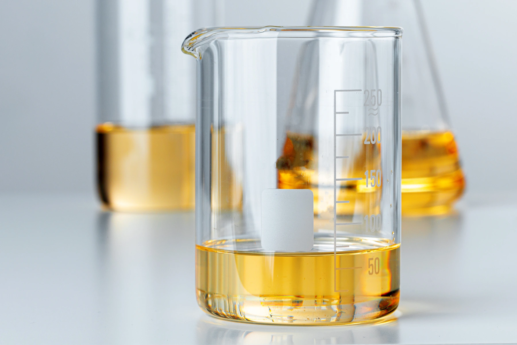Laboratory glassware with yellow liquid