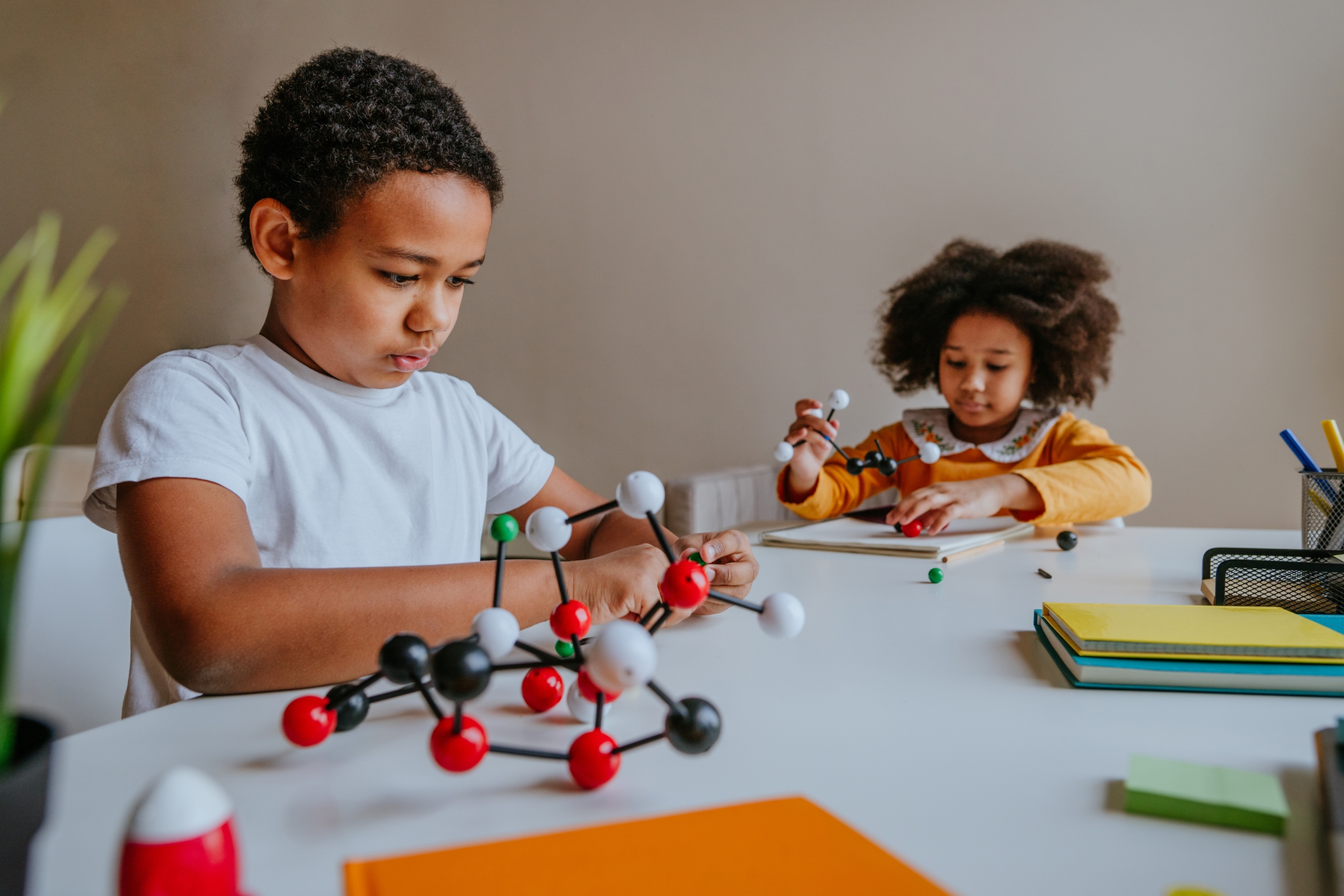 KS1 students doing simple science activity in class