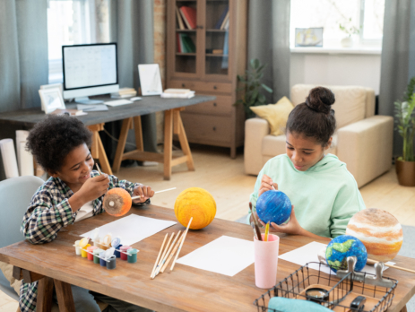 Two children at table doing STEM activities