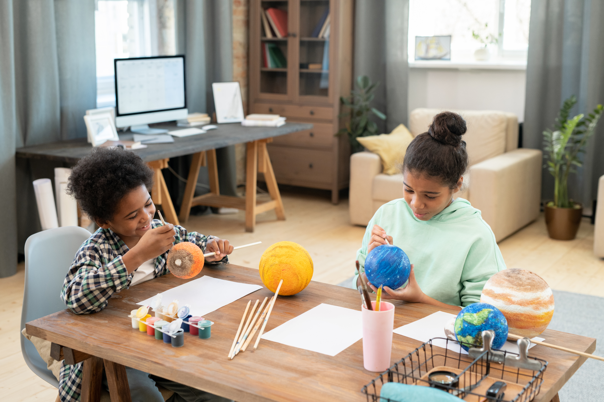 Two children at table doing STEM activities