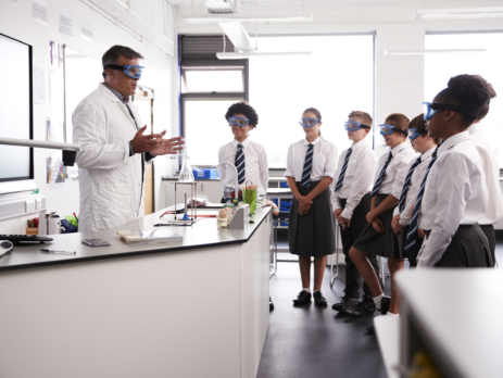 Teacher explaining science lab safety rules to the class