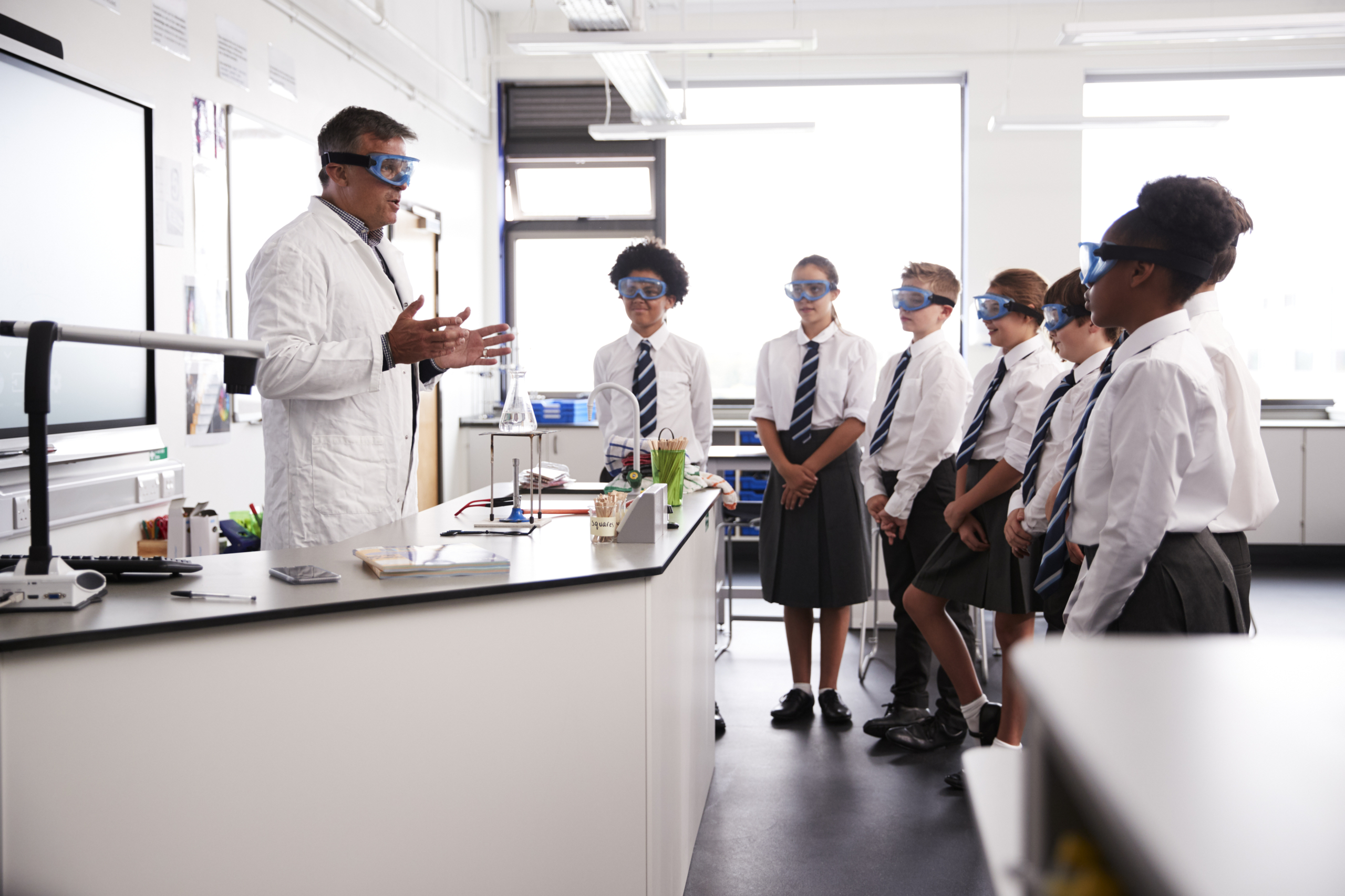 Teacher explaining science lab safety rules to the class