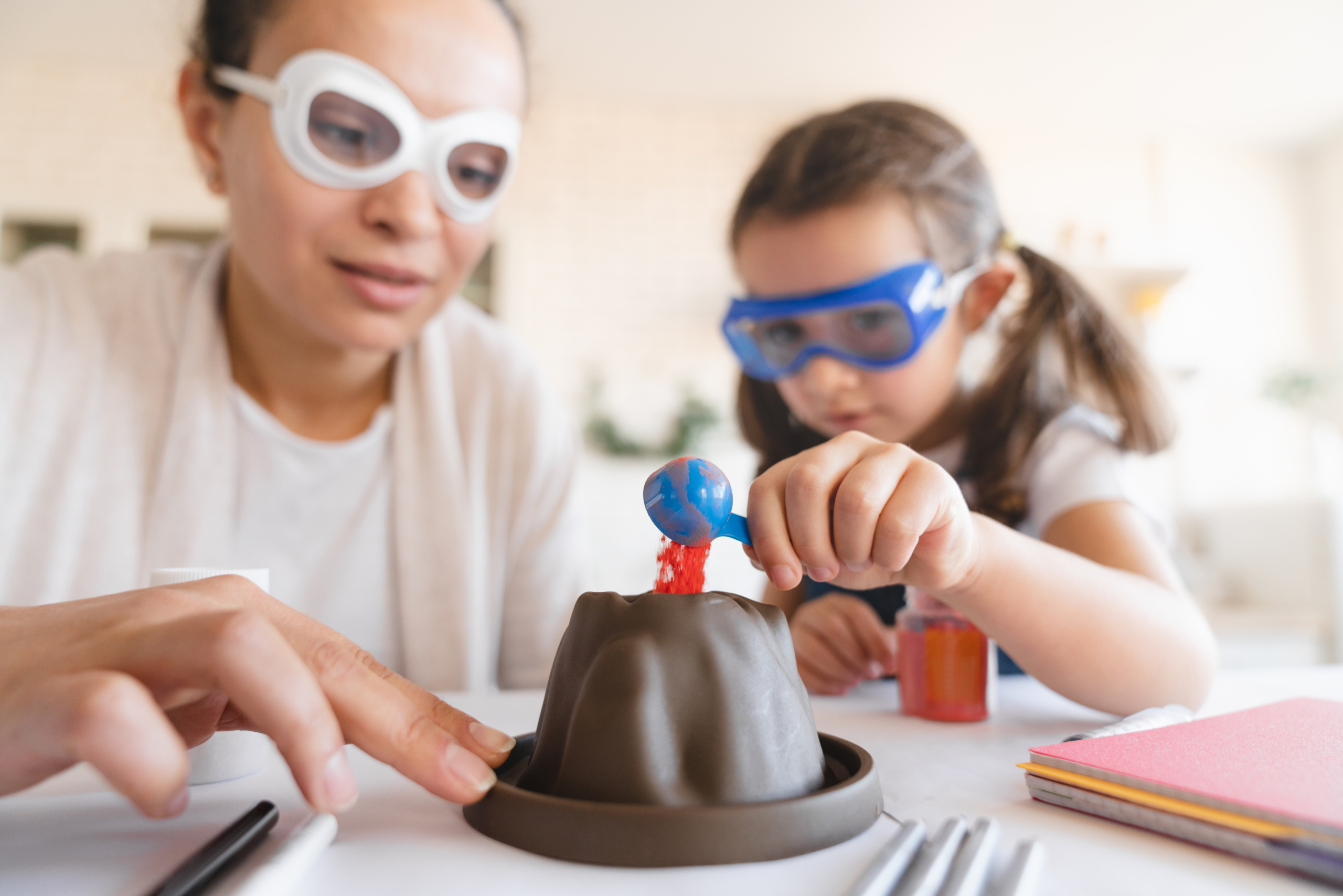 Mother and daughter conducting a fizzy volcano experiment